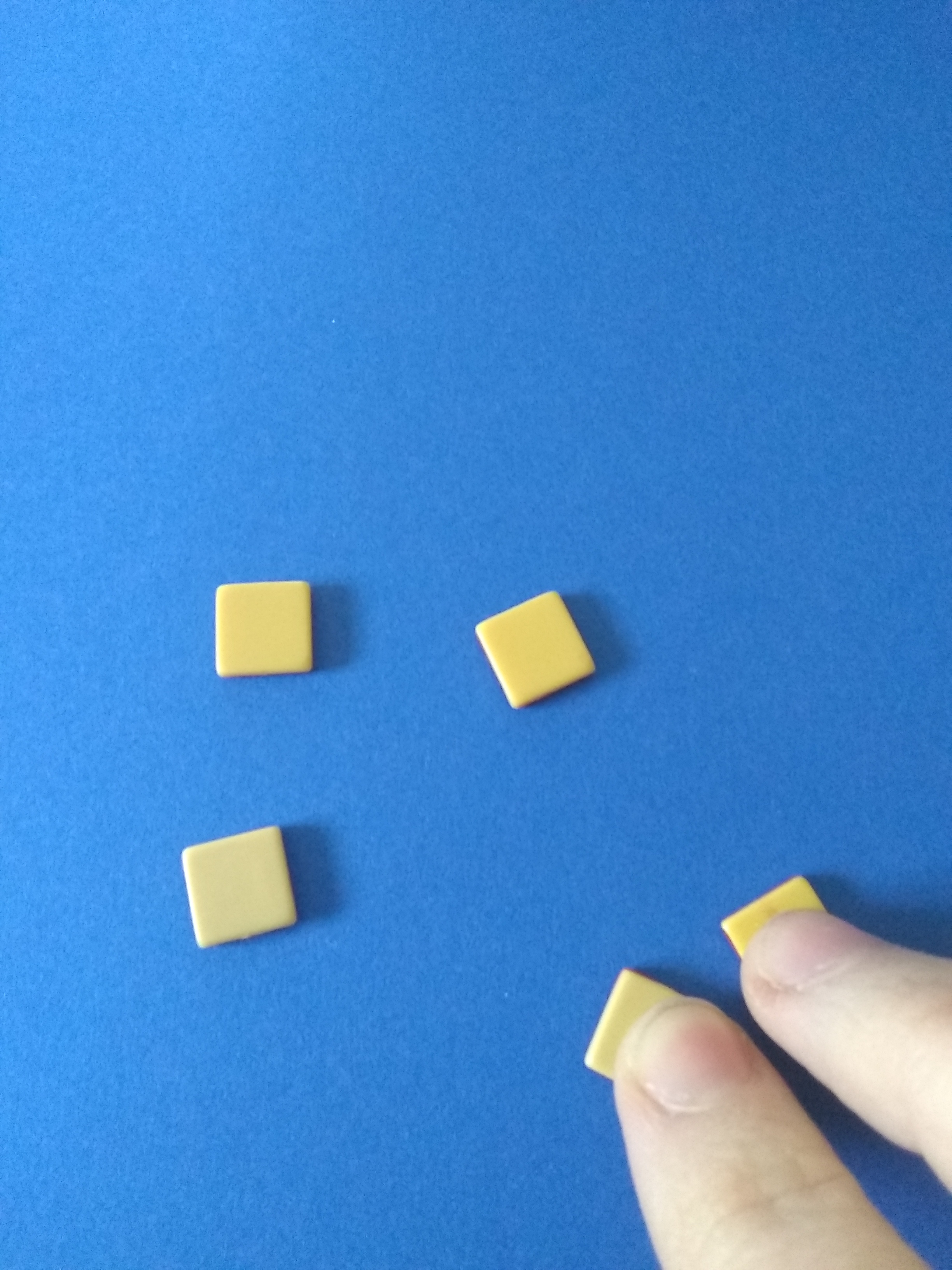 5 counters, 2 being pulled away by fingers