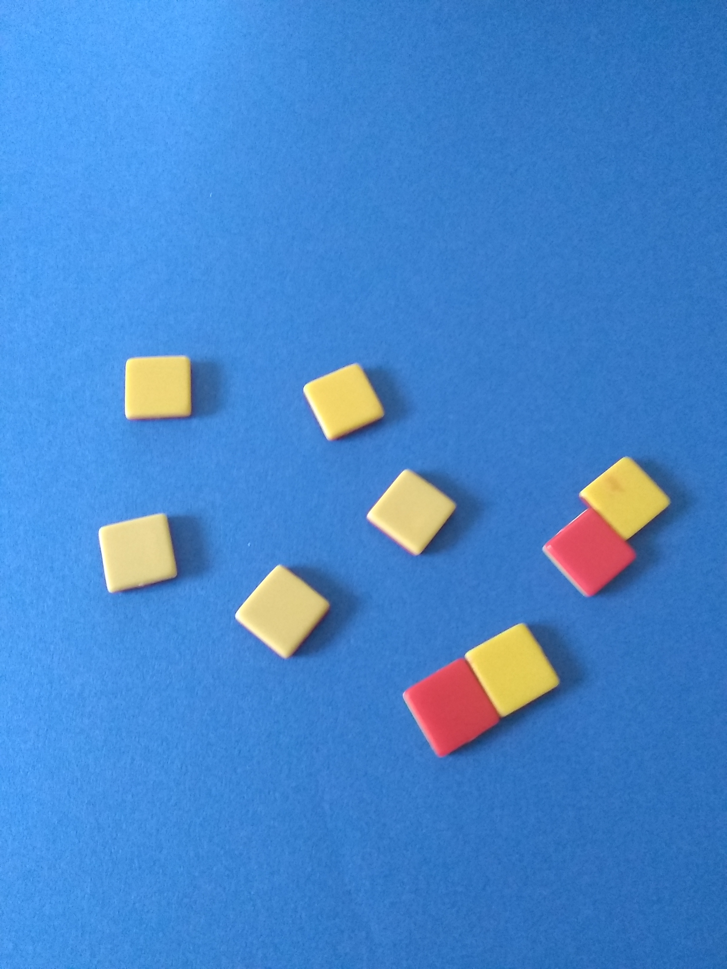 7 postive (off-white) and 2 negative (red) counters