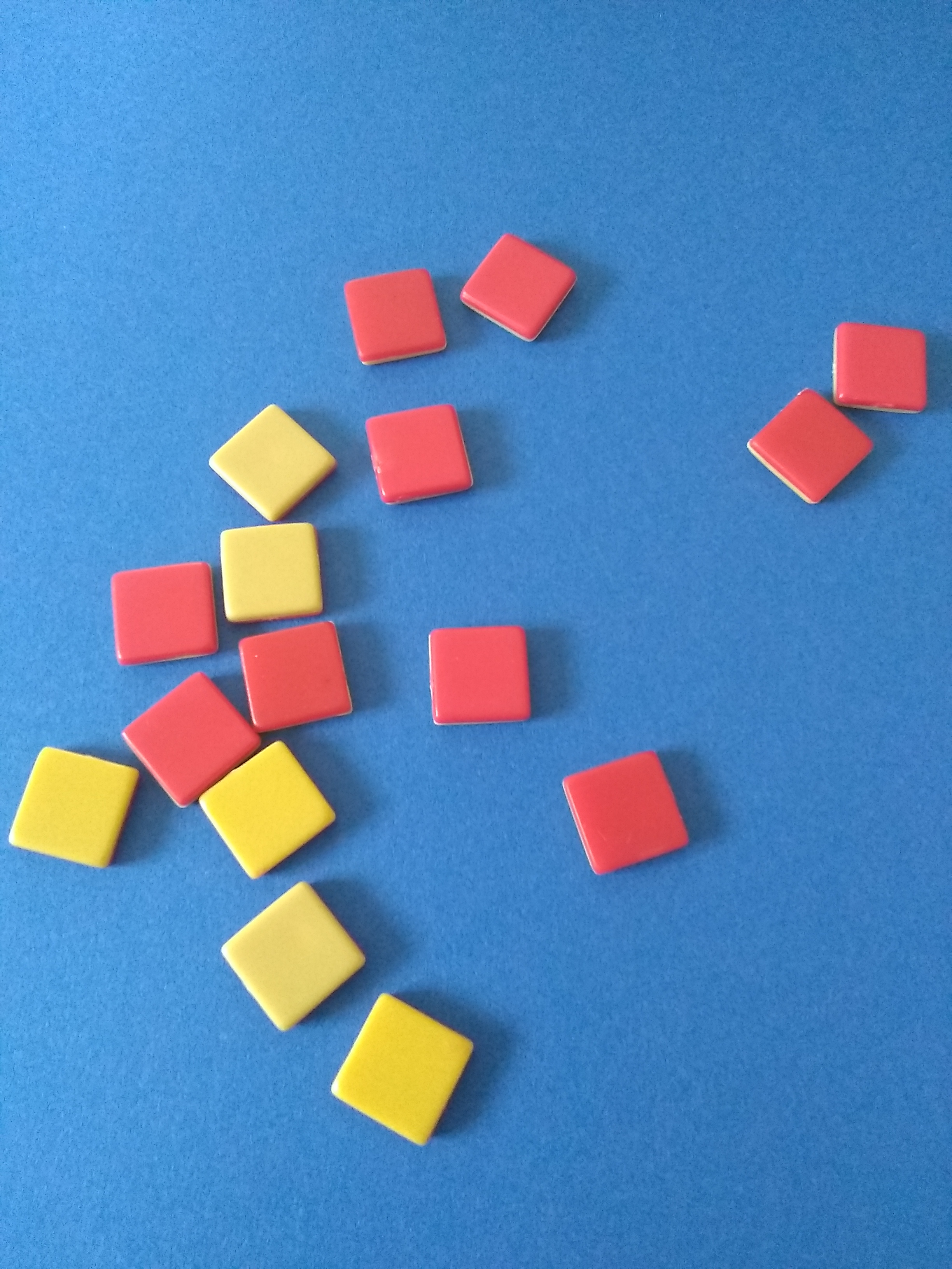 red and white plastic squares on a blue background